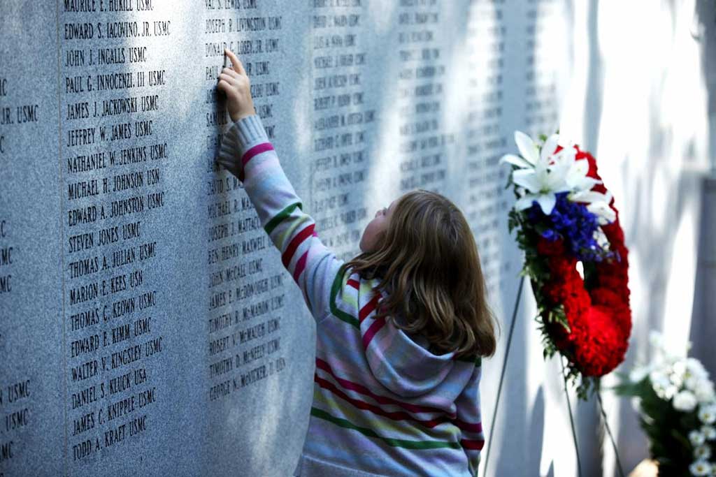 A girl at the Beirut Memorial wall
